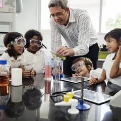 Kids with science teacher
